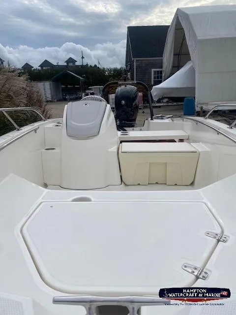 Slide: The Image of 2024 Boston Whaler 160 Super Sport boat, rear view, docked at marina. - 23