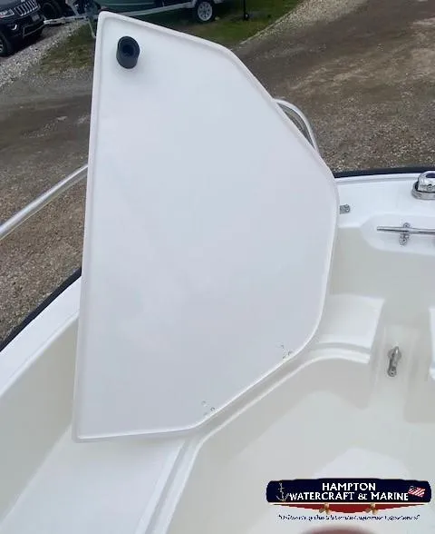 Slide: The Image of 2024 Boston Whaler 160 Super Sport boat with open storage compartment. - 25