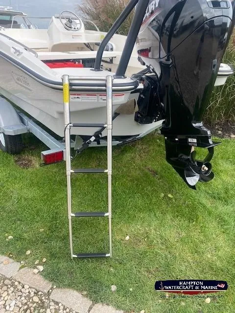 Slide: The Image of 2024 Boston Whaler 160 Super Sport boat with ladder and outboard motor. - 6