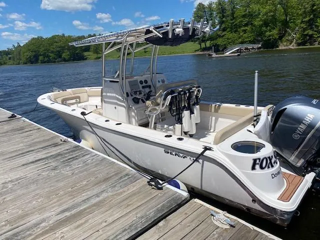Slide: The Image of 2018 Sea Fox 249 Avenger boat docked on a sunny day. - 10