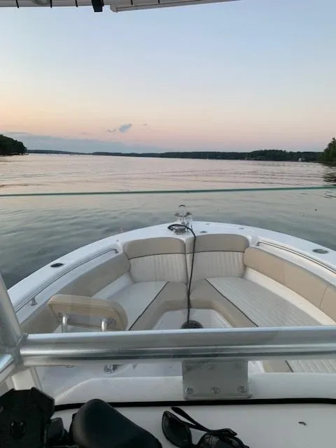 Slide: The Image of 2018 Sea Fox 249 Avenger boat on a calm lake at sunset. - 4