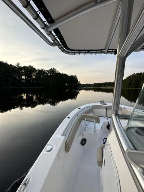 Slide: The Image of 2018 Sea Fox 249 Avenger boat on a calm lake at sunset. - 5