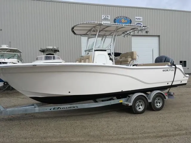 Slide: The Image of 2018 Sea Fox 249 Avenger boat on trailer outside a warehouse. - 6