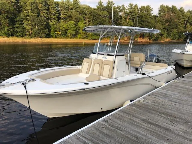 Slide: The Image of 2018 Sea Fox 249 Avenger boat docked on a calm lake. - 7