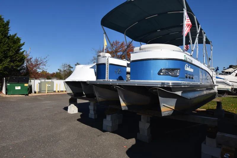 Slide: The Image of 2020 Avalon 2585 ENT SaltWater Series pontoon boat in storage. - 0