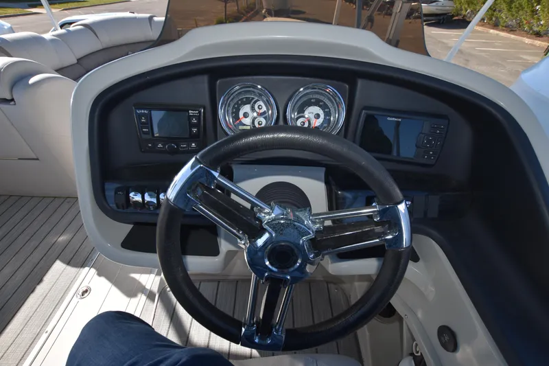 Slide: The Image of 2020 Avalon 2585 ENT SaltWater Series boat dashboard with steering wheel and instrument panel. - 13