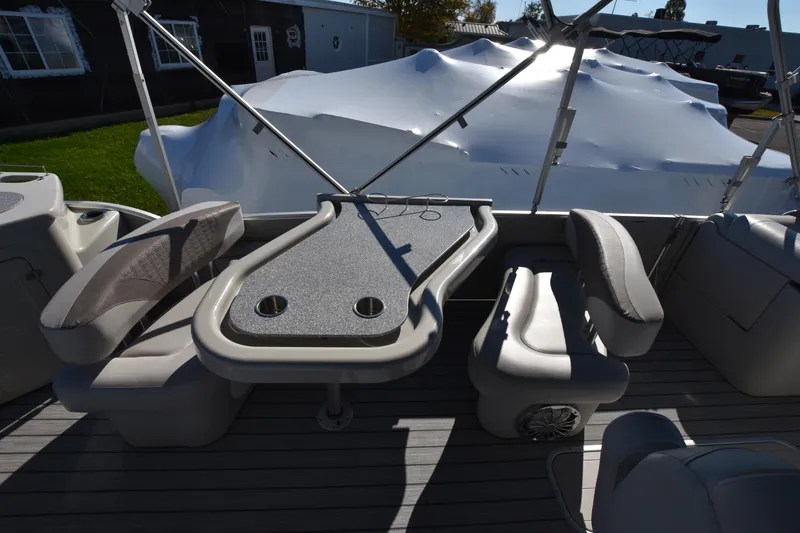 Slide: The Image of 2020 Avalon 2585 ENT SaltWater Series boat interior with seating and table. - 14