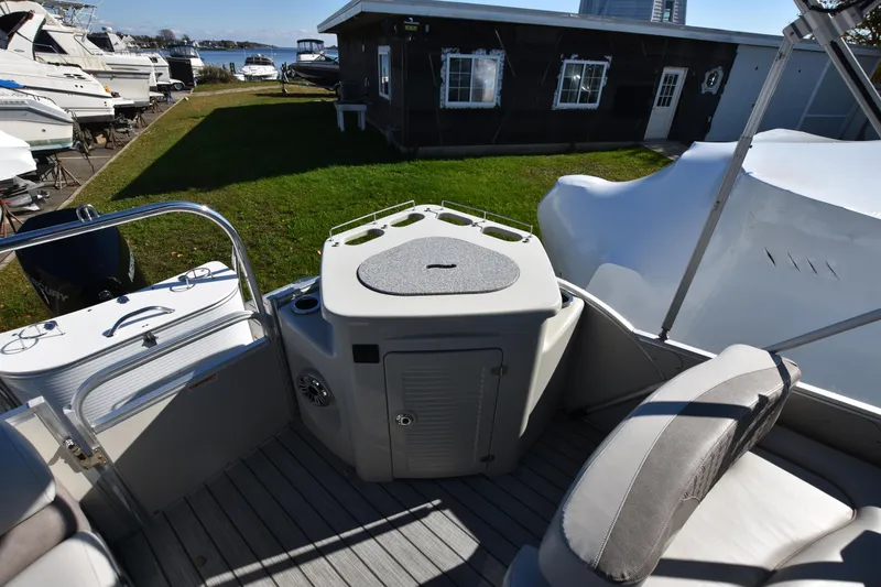 Slide: The Image of 2020 Avalon 2585 ENT SaltWater Series boat interior with seating and storage. - 16