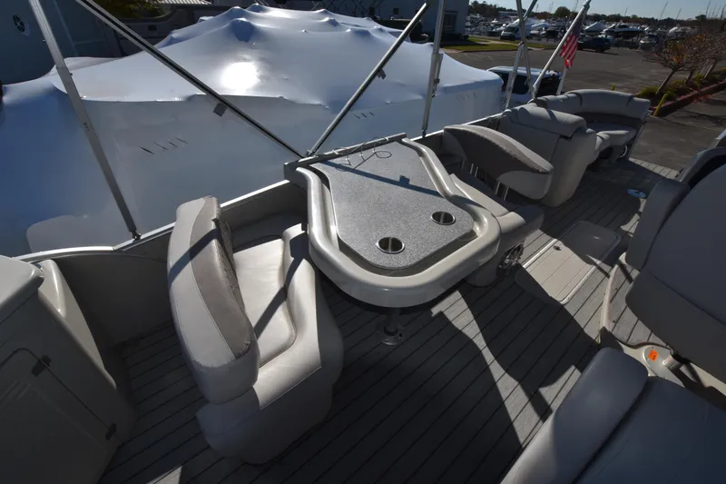 Slide: The Image of 2020 Avalon 2585 ENT SaltWater Series boat interior with seating and table. - 19