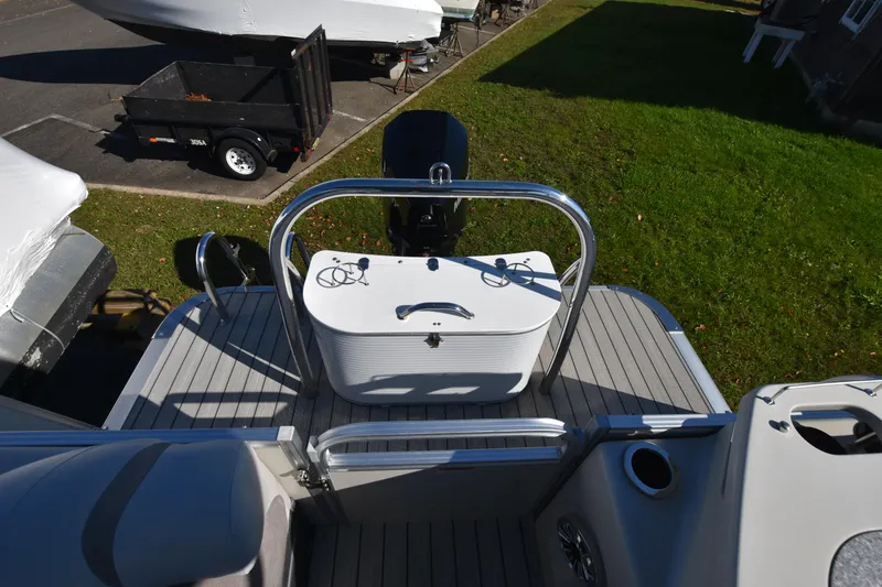 Slide: The Image of 2020 Avalon 2585 ENT SaltWater Series boat deck with motor and seating area. - 20