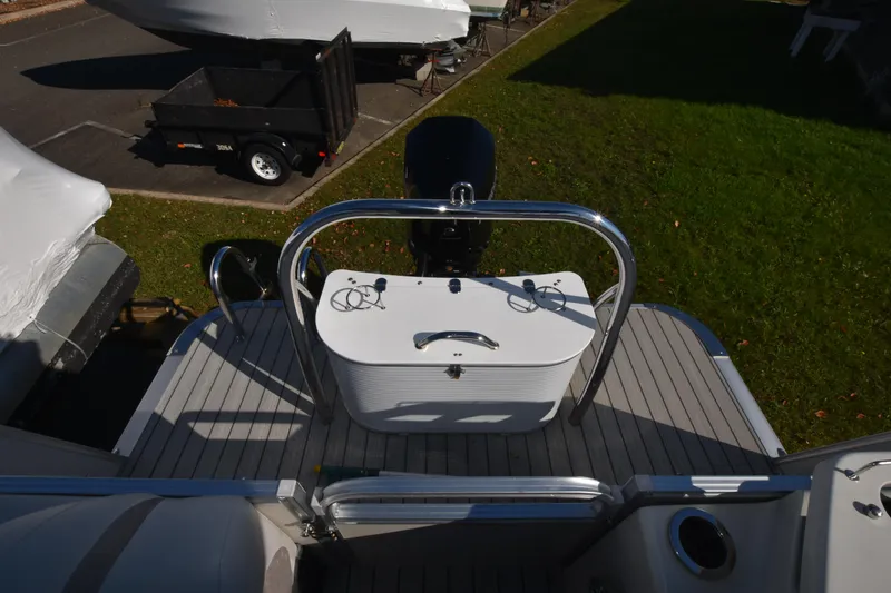 Slide: The Image of 2020 Avalon 2585 ENT SaltWater Series boat stern with motor and control panel. - 23