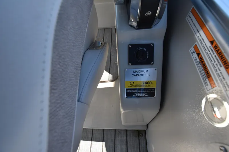 Slide: The Image of 2020 Avalon 2585 ENT SaltWater Series boat maximum capacities label and warning signs. - 26