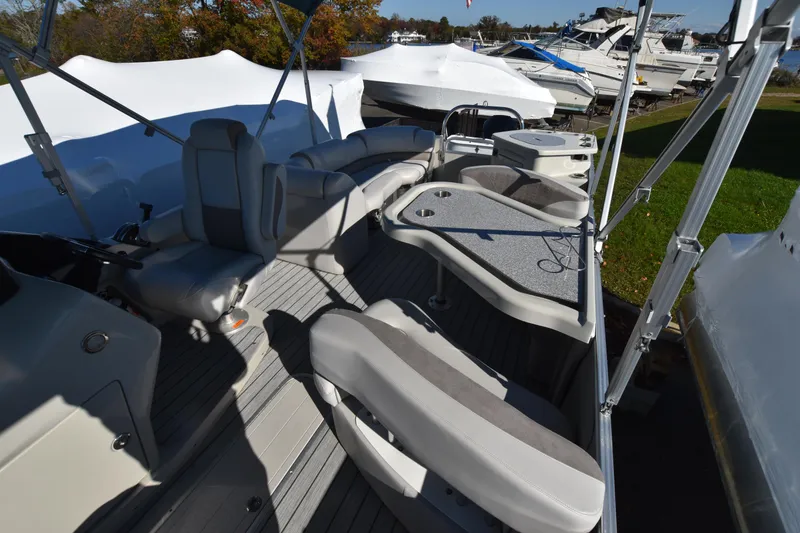 Slide: The Image of 2020 Avalon 2585 ENT SaltWater Series boat interior with seating and tables. - 7
