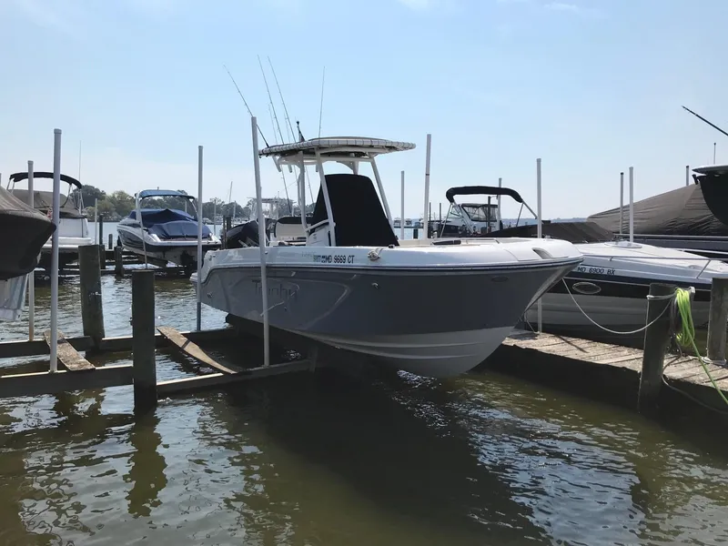 Slide: The Image of 2022 Bayliner Trophy T24CC boat docked at a marina. - 11