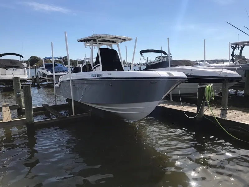 Slide: The Image of 2022 Bayliner Trophy T24CC boat docked at a marina. - 12