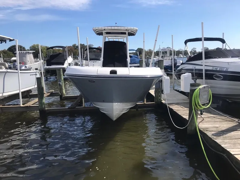 Slide: The Image of 2022 Bayliner Trophy T24CC boat docked at a marina. - 13
