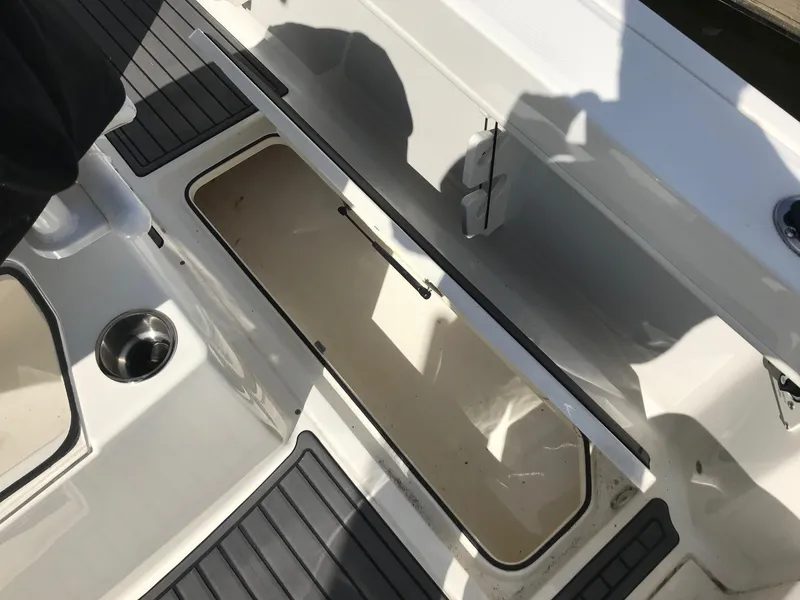 Slide: The Image of Open storage compartment on 2022 Bayliner Trophy T24CC boat. - 32