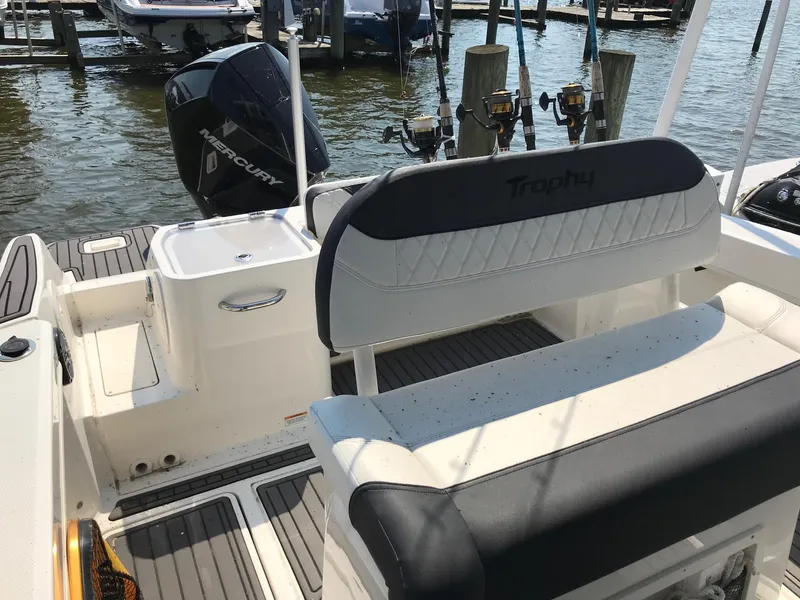 Slide: The Image of 2022 Bayliner Trophy T24CC boat interior with seating and Mercury outboard motor. - 7