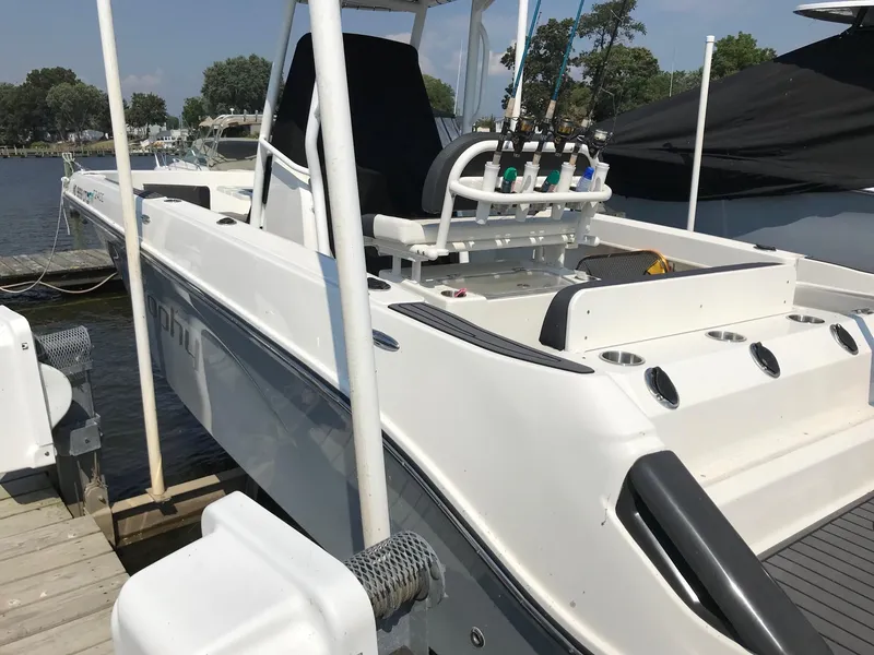 Slide: The Image of 2022 Bayliner Trophy T24CC boat docked at marina, rear view. - 9