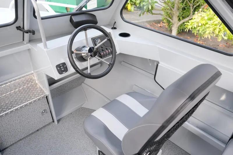 Slide: The Image of 2024 Hewescraft 180 Pro-V ET boat interior with steering wheel and seating. - 14