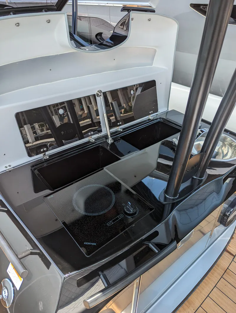 Slide: The Image of Modern kitchen area on the 2025 Panamera Yacht PY 100 with sleek black appliances. - 17