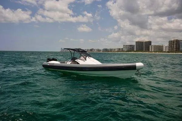 Slide: The Image of Panamera Yacht PY 100 2025 model cruising on open water near a coastal city. - 29