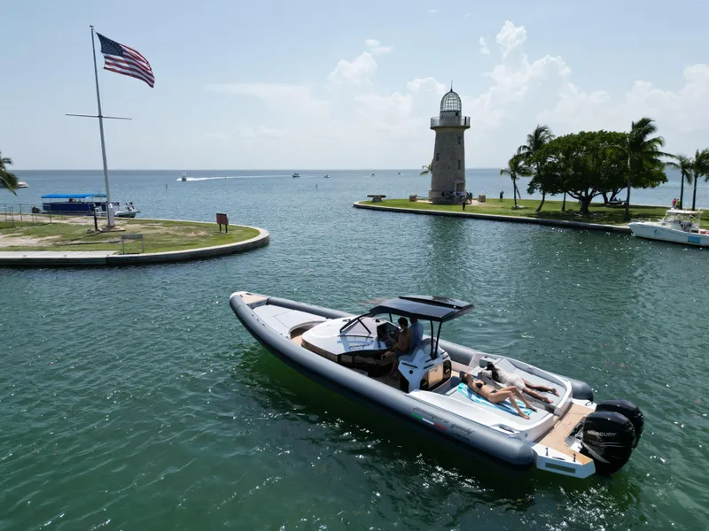 Slide: The Image of 2025 Panamera Yacht PY 100 cruising near a lighthouse and American flag. - 4