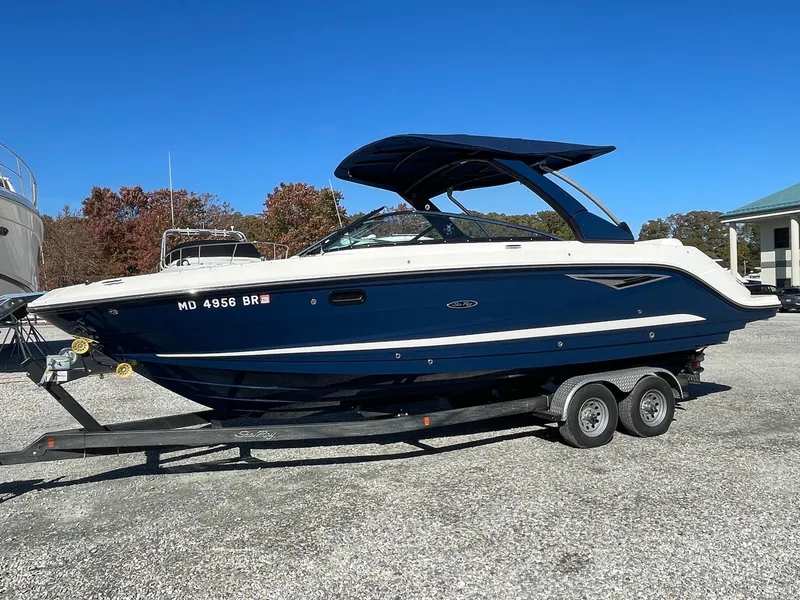 The Image of 2022 Sea Ray SLX 280 boat on trailer, parked outdoors. - 1