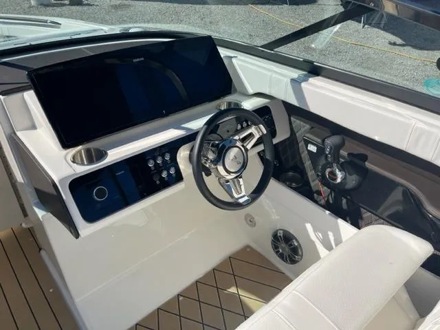 Slide: The Image of 2022 Sea Ray SLX 280 helm with modern controls and sleek design. - 13