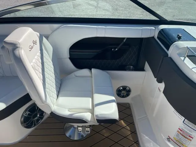 Slide: The Image of 2022 Sea Ray SLX 280 interior with white seating and modern design. - 6