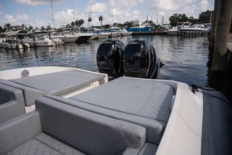Slide: The Image of 2025 Panamera Yacht PY 100 at marina with twin outboard motors. - 9