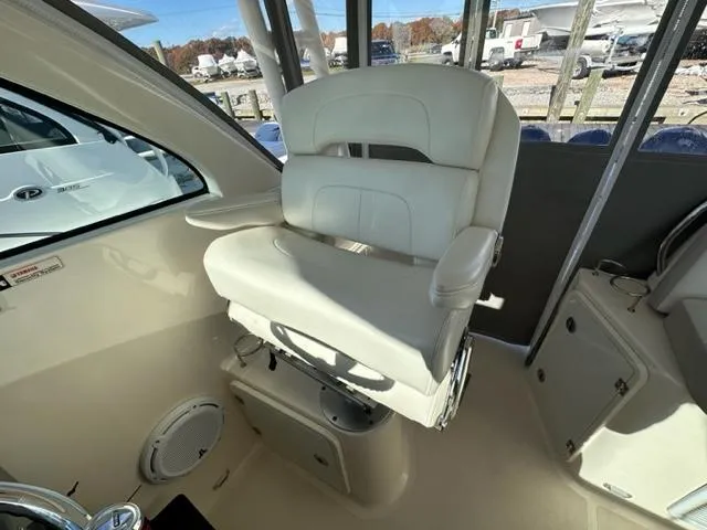 Slide: The Image of Captain's chair in 2012 Pursuit OS 375 Offshore boat cockpit. - 12