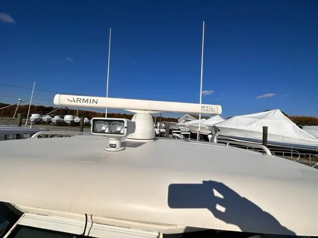 Slide: The Image of 2012 Pursuit OS 375 Offshore boat with Garmin radar and spotlight. - 23