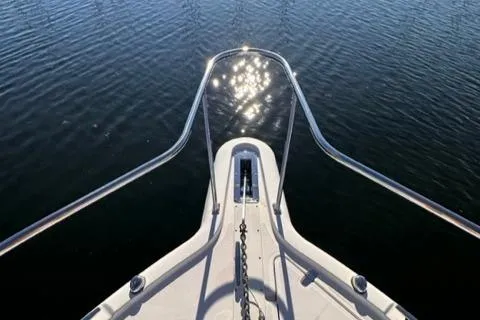 Slide: The Image of Bow of 2012 Pursuit OS 375 Offshore boat on calm water. - 36