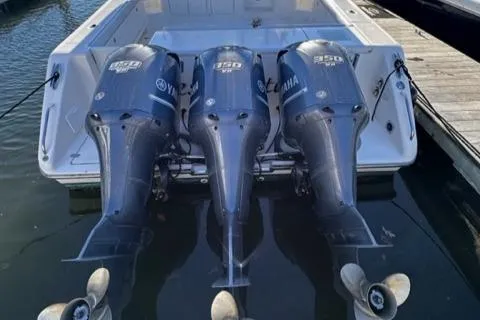 Slide: The Image of 2012 Pursuit OS 375 Offshore with triple Yamaha 350 engines docked. - 38