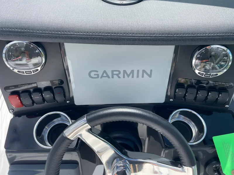 Slide: The Image of 2024 Blackfin 232DC boat dashboard with Garmin navigation system. - 24