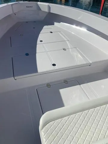 Slide: The Image of 2024 Bahama 41' Open Fisherman boat deck with storage compartments. - 7