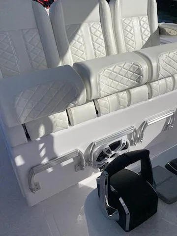 Slide: The Image of 2024 Bahama 41' Open Fisherman boat with white quilted seats and modern controls. - 8
