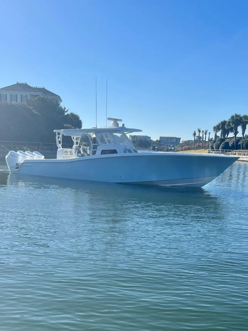 Slide: The Image of 2024 Invincible 43 Open Fisherman boat on calm water. - 2