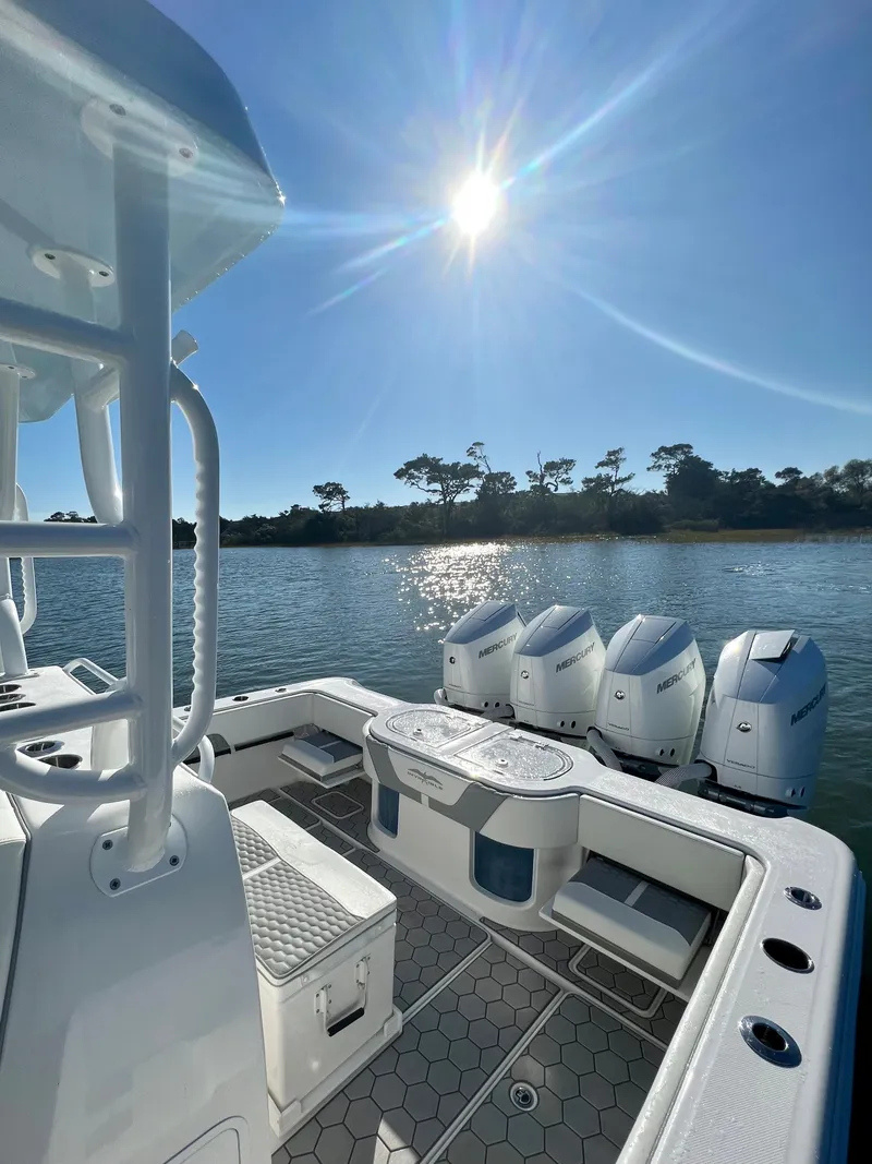 Slide: The Image of 2024 Invincible 43 Open Fisherman boat with quad engines on a sunny day. - 5