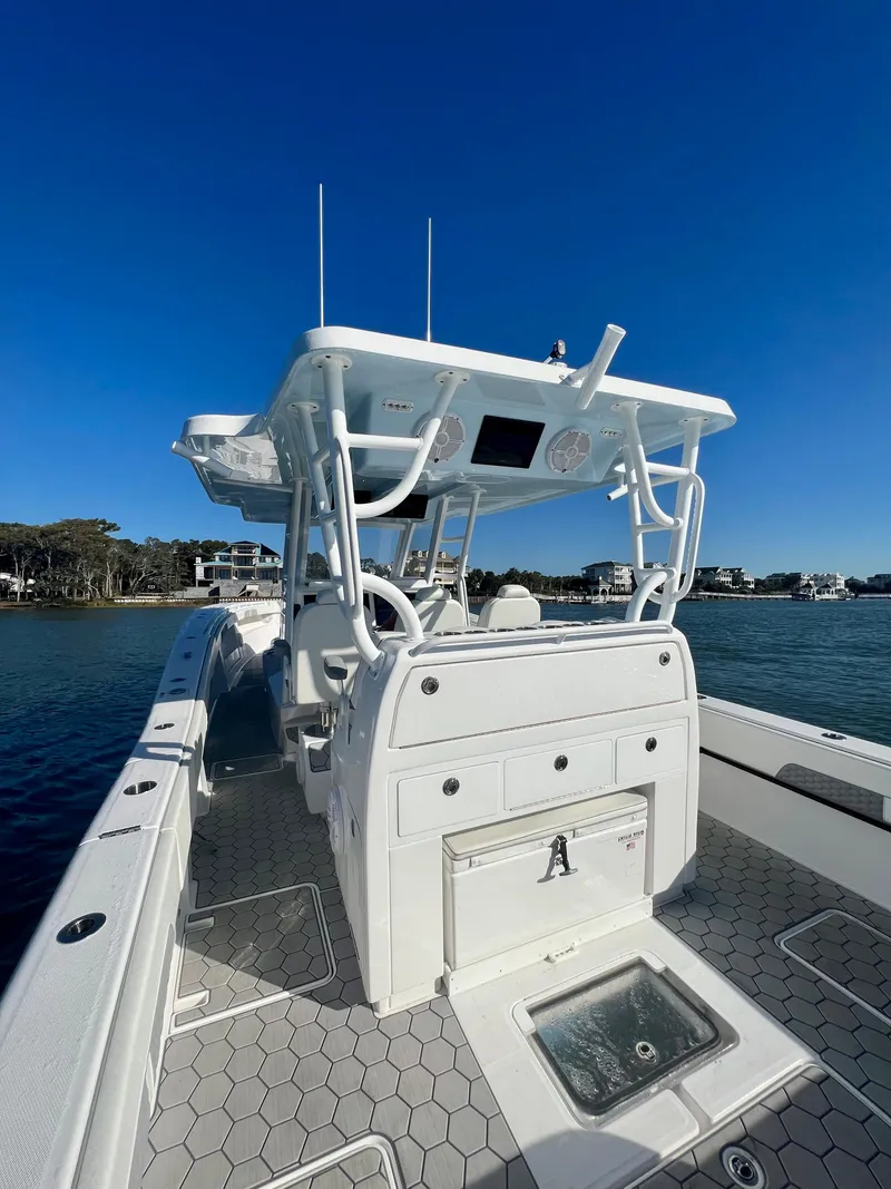 Slide: The Image of 2024 Invincible 43 Open Fisherman boat on water, showcasing deck and console. - 9