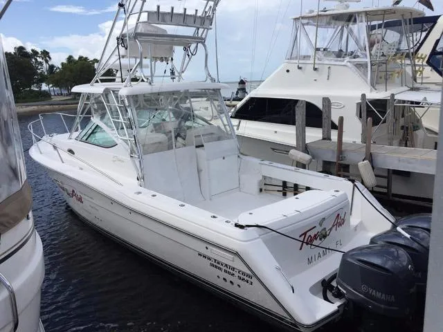 Slide: The Image of 2015 Stamas 390 Aegean boat docked in marina with twin Yamaha engines. - 11