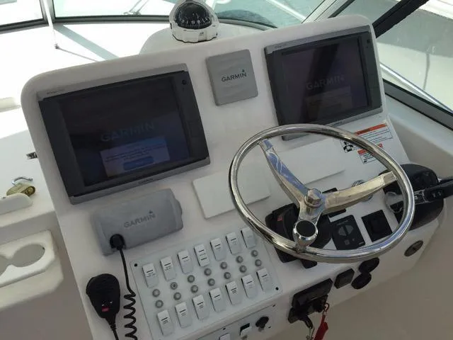 Slide: The Image of Control panel of a 2015 Stamas 390 Aegean boat with Garmin navigation systems. - 13