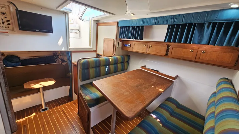 Slide: The Image of Interior of 2015 Stamas 390 Aegean boat with cozy seating and wooden table. - 19
