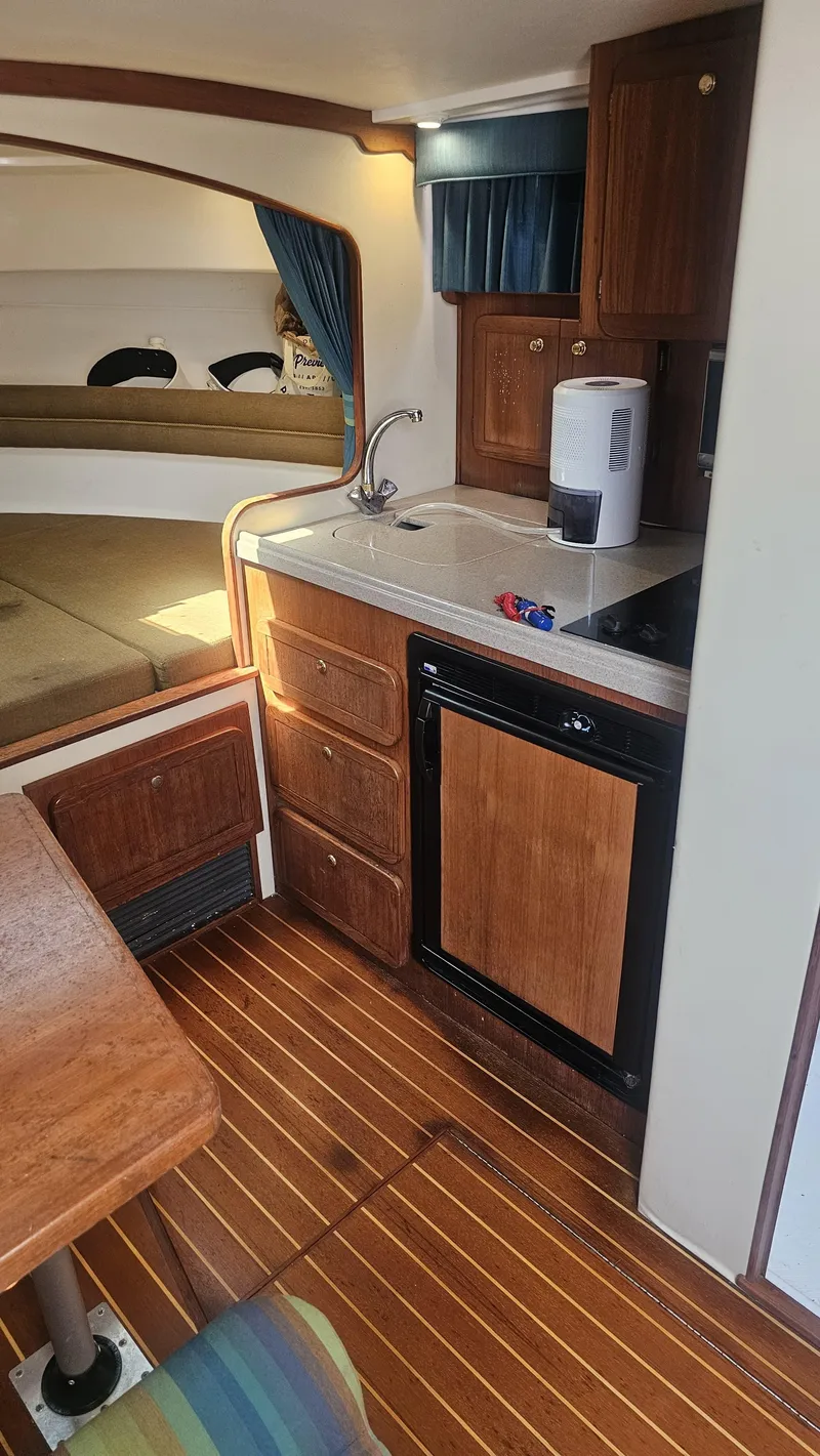 Slide: The Image of 2015 Stamas 390 Aegean cabin interior with kitchenette and seating area. - 23