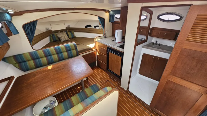 Slide: The Image of Interior of 2015 Stamas 390 Aegean boat with cozy seating and kitchenette. - 26
