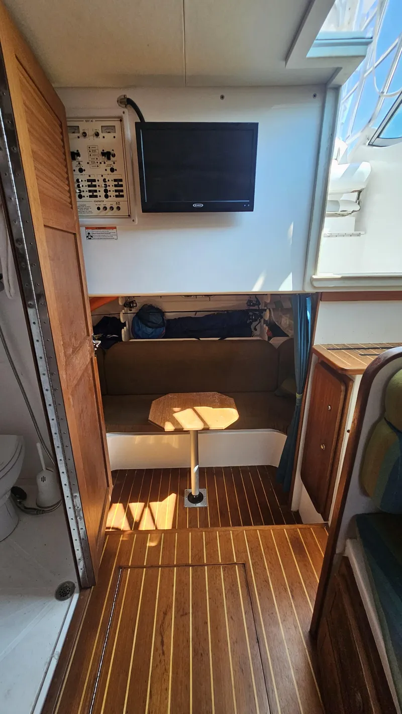 Slide: The Image of Interior of 2015 Stamas 390 Aegean boat with wood flooring and mounted TV. - 27