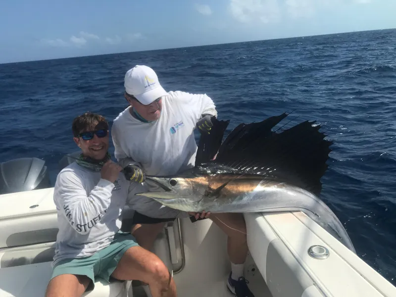 Slide: The Image of Two men on a 2015 Stamas 390 Aegean boat with a large sailfish. - 36