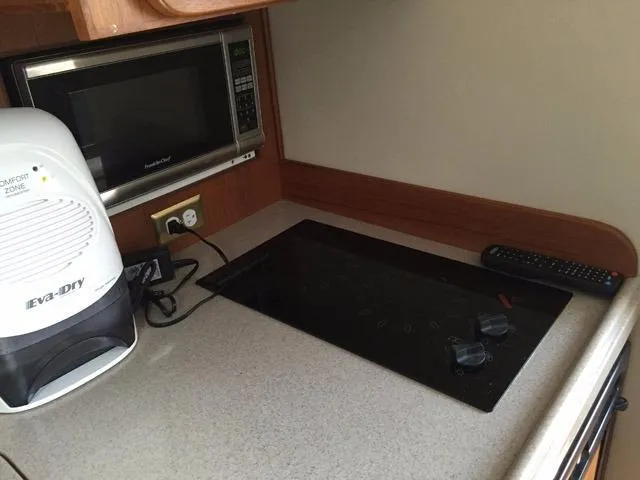 Slide: The Image of Compact kitchen area in 2015 Stamas 390 Aegean boat with microwave and stovetop. - 5