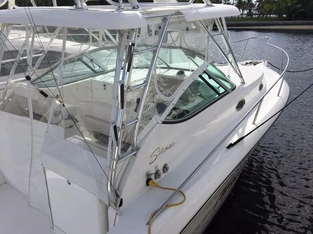 Slide: The Image of 2015 Stamas 390 Aegean boat docked, showcasing sleek design and spacious deck. - 9